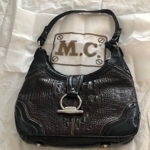 Rich and beautiful brown purse with silver decor!